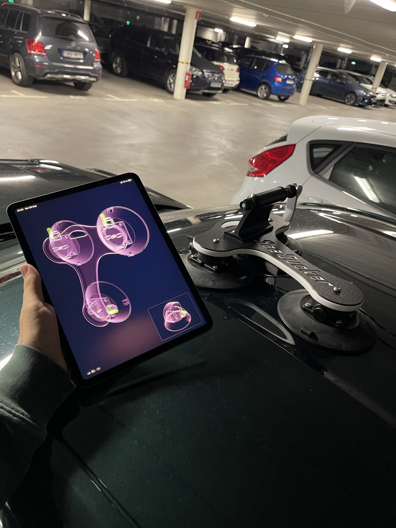 Kraken Rack Monitor app on an iPad showing a 3D SeaSucker Talon rack next to a real Talon on roof.