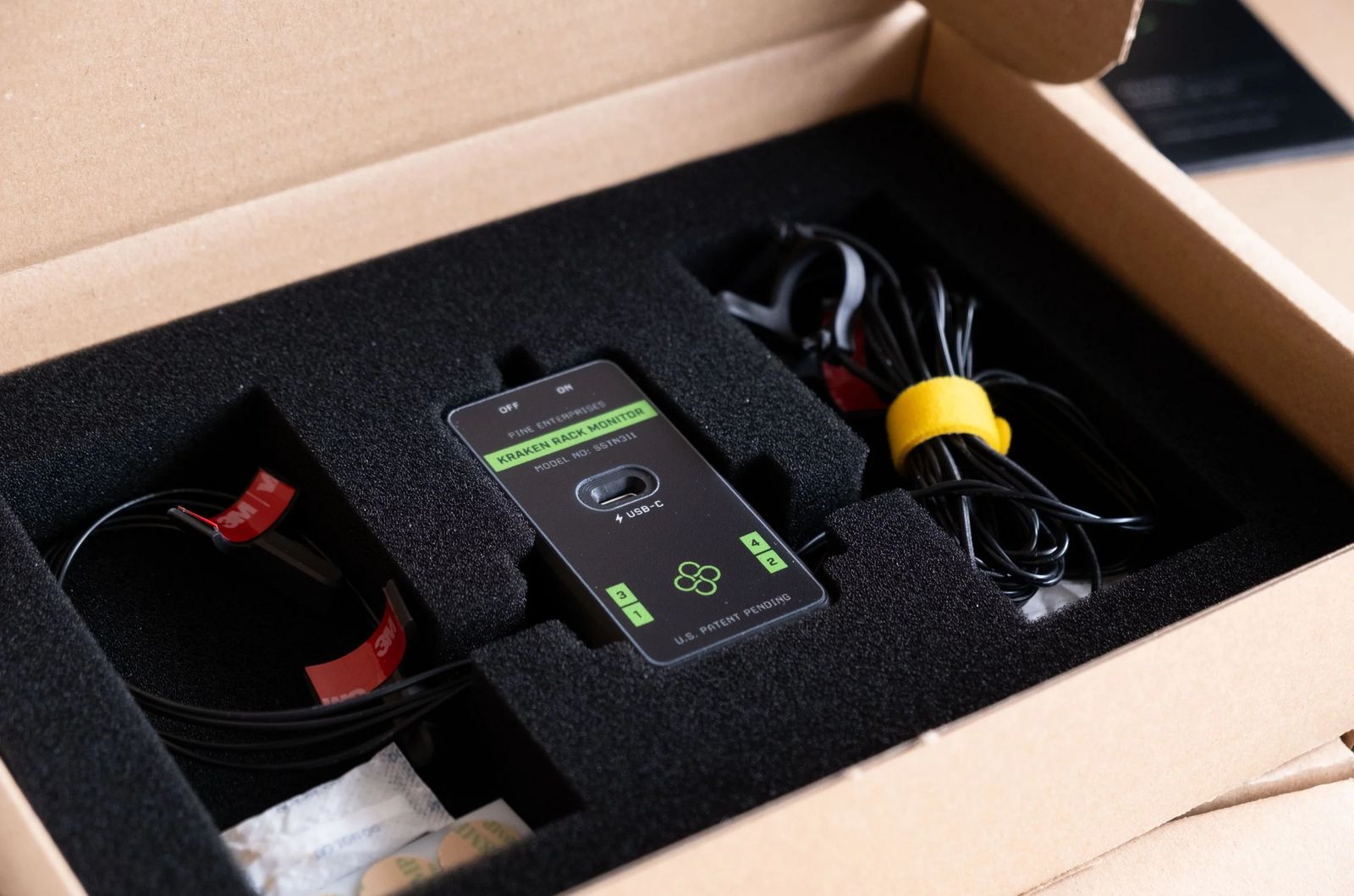 Kraken Rack Monitor kit packed in foam inside its box