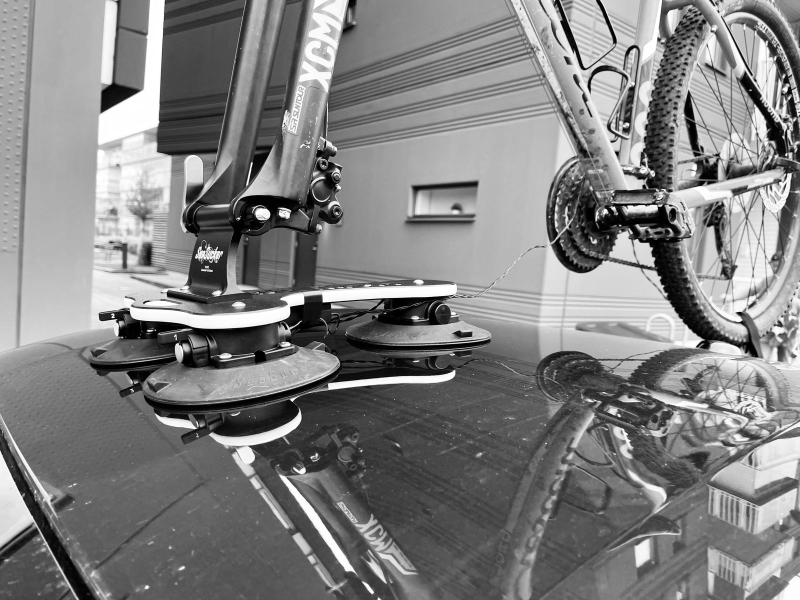 SeaSucker Talon rack with a bike mounted on the car roof